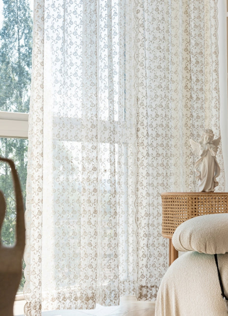 a living room with a couch and a window