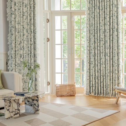 a living room filled with furniture and a large window