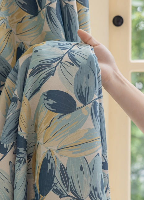 a person is opening a curtain with a curtain rod