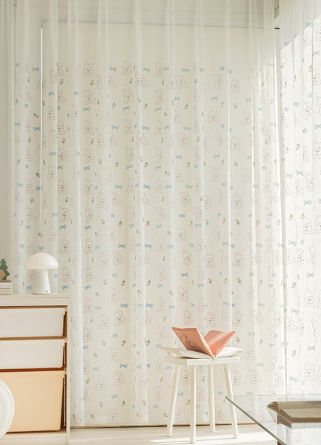 a room with a chair, dresser and a window