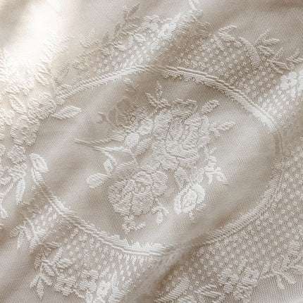 a close up of a white cloth with a design on it
