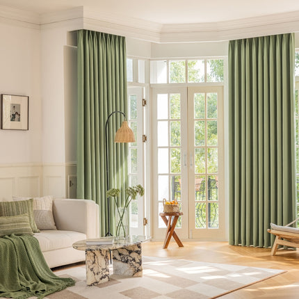 a living room filled with furniture and a large window