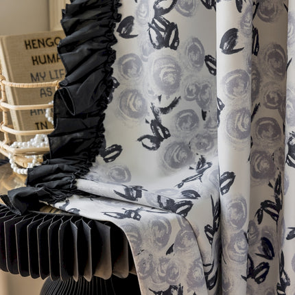 a close up of a curtain with a chair in the background