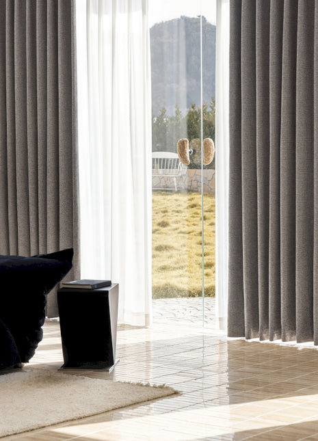 a living room with a large sliding glass door