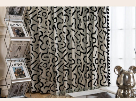 a curtain with a black and white pattern on it