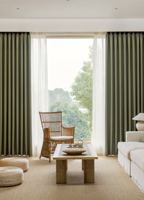 a living room filled with furniture and a large window