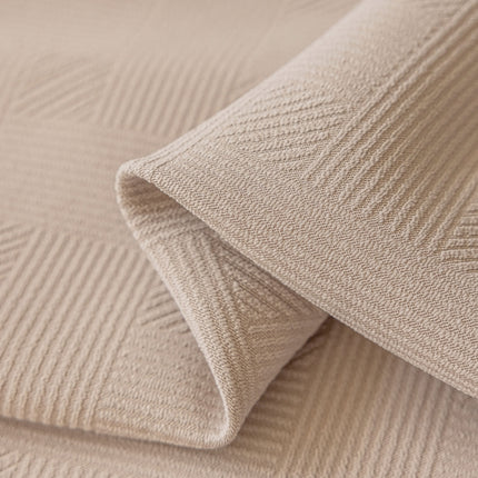 a close up view of a beige fabric